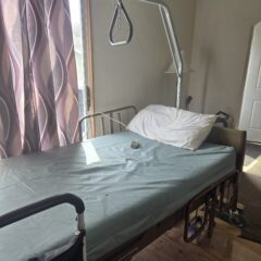 Advacare electric hospital bed; head, feet, and bed are adjustable with mattress, trapeze,side rails